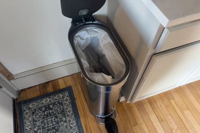 The Simplehuman 12 Gallon Slim Hands-Free Kitchen Step Trash Can with its lid open