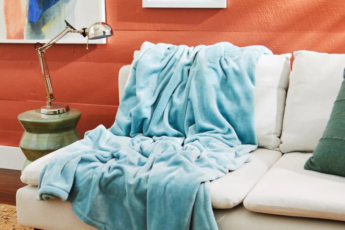 The L.L. Bean Wicked Cozy Blanket resting on a sofa