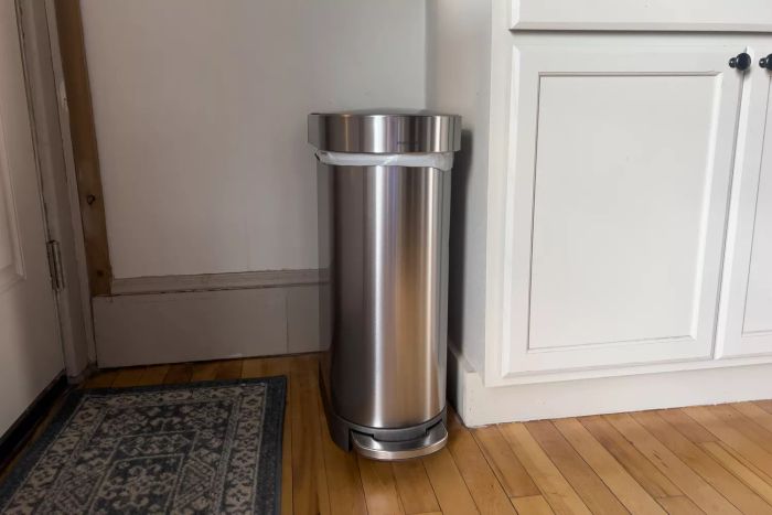 The Simplehuman 12 Gallon Slim Hands-Free Kitchen Step Trash Can positioned in a kitchen