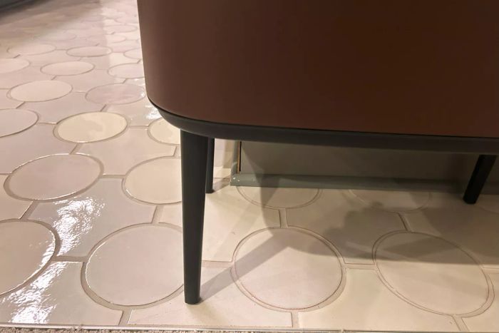 The legs of the Brabantia 3 + 6 Bo Touch Top Dual Compartment Recycling Trash Can
