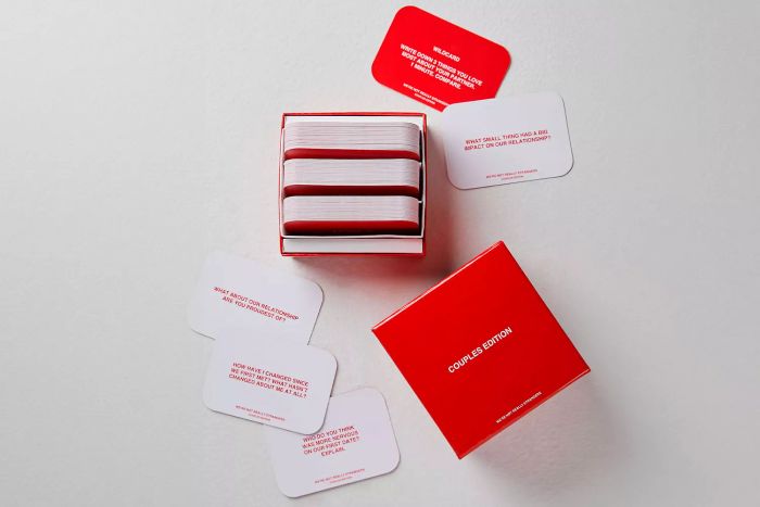 The We’re Not Really Strangers Couples Edition Card Game placed on the floor