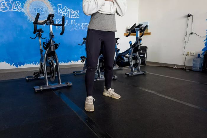 An individual models the On Running Movement Tights during a gym session