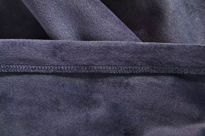 A detailed view of the stitching on the Big Blanket Co. Original Stretch Blanket