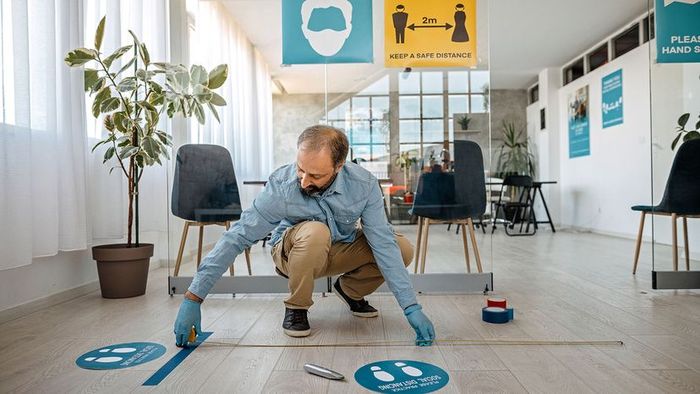 a person measuring a distance of 2 meters apart