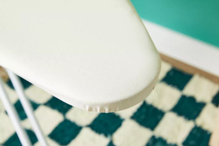 A detailed shot of the edge of the Brabantia Size B Ironing Board, emphasizing its design.