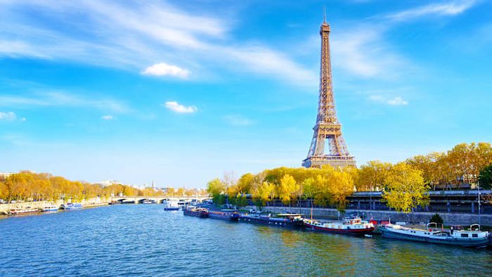The Eiffel Tower stands proudly along the banks of the River Seine.