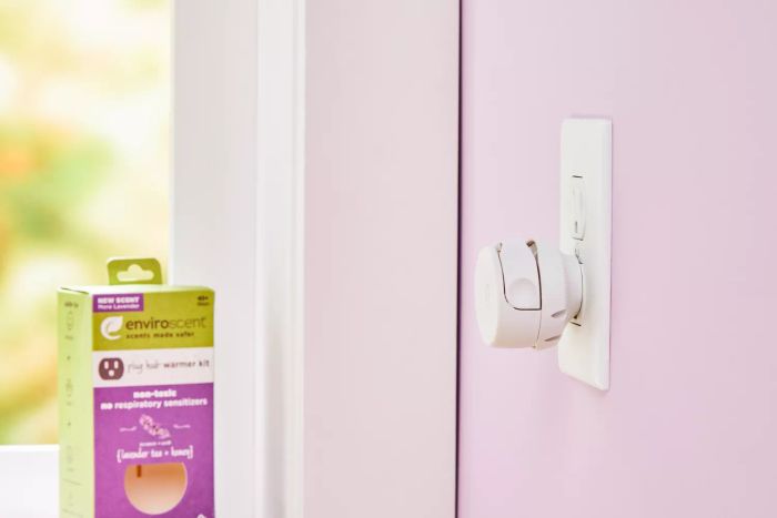 Enviroscent Plug Hub Starter Kit installed in a wall alongside its product packaging
