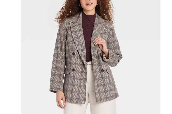 A double-breasted blazer offers a sophisticated and stylish option for outerwear, providing an added layer of warmth during colder fall weather.