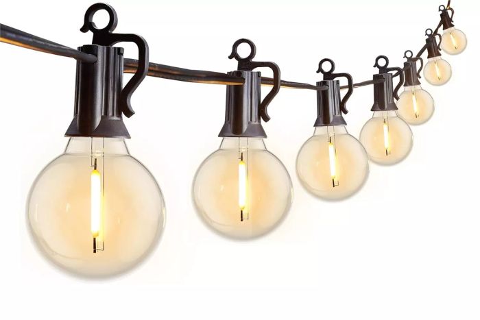 Brightown's 25 Feet G40 Globe LED Patio Lights, equipped with 13 Edison-style plastic bulbs (including one spare), are designed for outdoor use. These waterproof, connectable hanging lights are ideal for decorating backyards, porches, balconies, or party venues, featuring an E12 socket base and a sleek black finish.