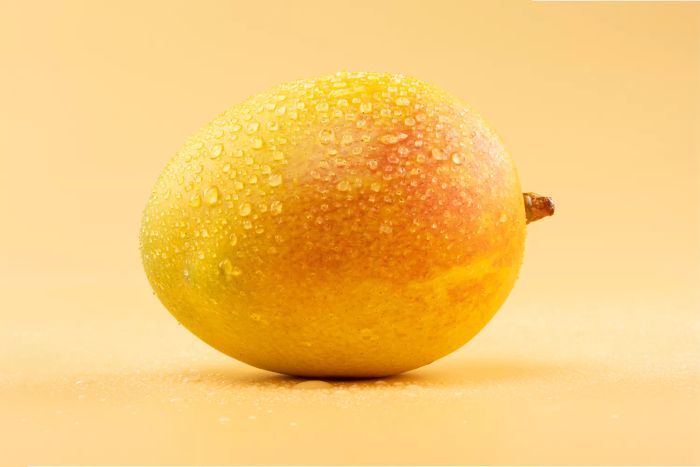 A vibrant photo of tropical fruits captured with professional studio lighting.