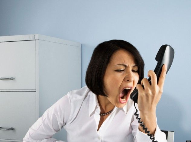 A businesswoman yelling into a phone. The image was captured in 2008, though the precise date is unclear.