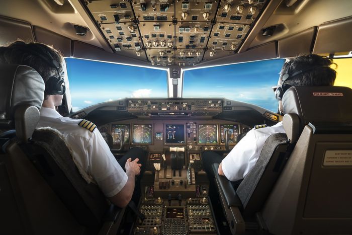 Two pilots in the cockpit.