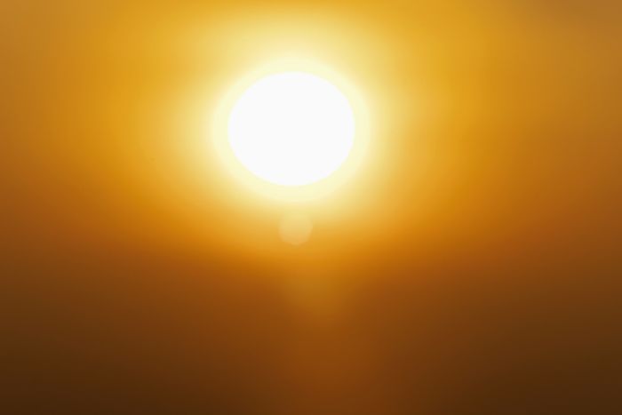The blazing sun in the sky