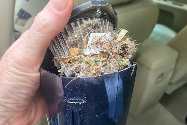 The filter of the Huepar Car Vacuum, 13000PA Cordless Portable Car Vacuum Cleaner being removed