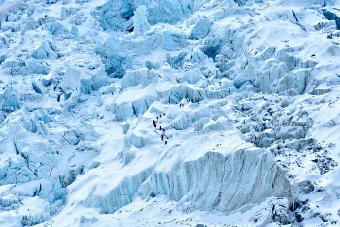 Hikers trekking on Mount Everest