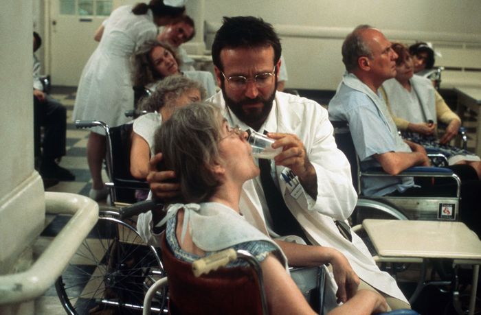 Robin assisting a patient in a wheelchair in *Awakenings*
