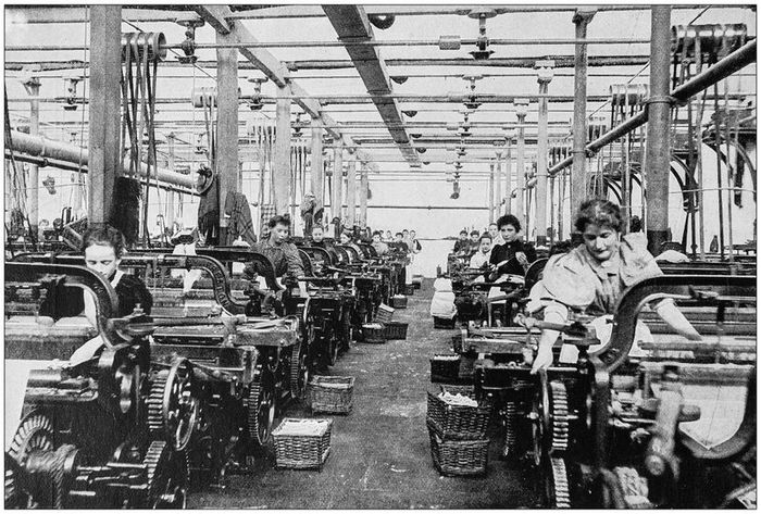 A vintage photograph depicting a Lancashire cotton mill from the British Empire era