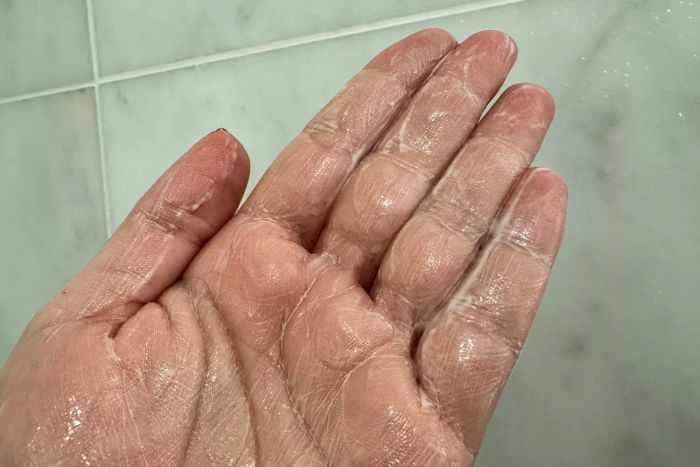 fresh Milk Body Cleanser on a person's hand