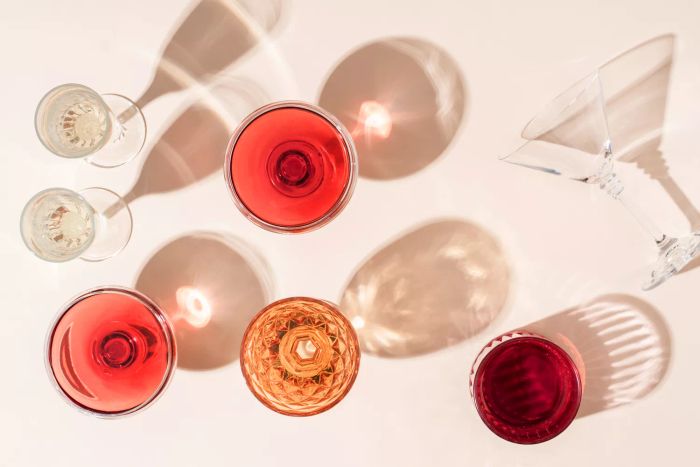 A wine glass casting its shadow — this image captures more than just the drink; it reflects the mindset behind modern trends like intermittent sobriety.
