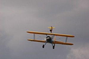 Aerobatics refers to the art of performing acrobatic maneuvers in an aircraft, often involving dramatic loops, rolls, and twists in mid-air, showcasing the skill and precision of the pilot.