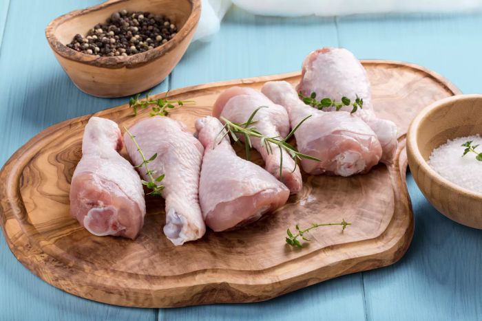 raw chicken on a cutting board