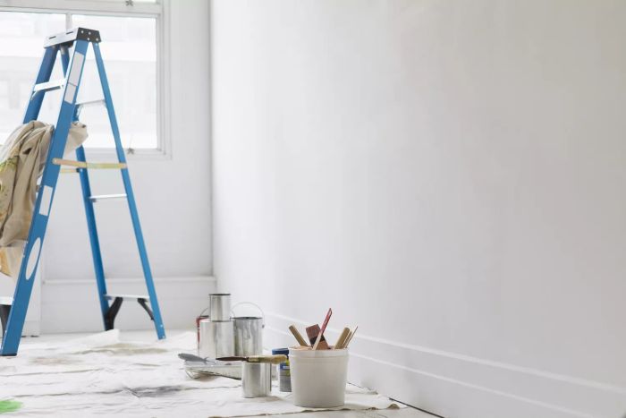 room with painting tools and ladder