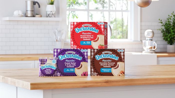 A box of Uncrustables sandwiches is shown.