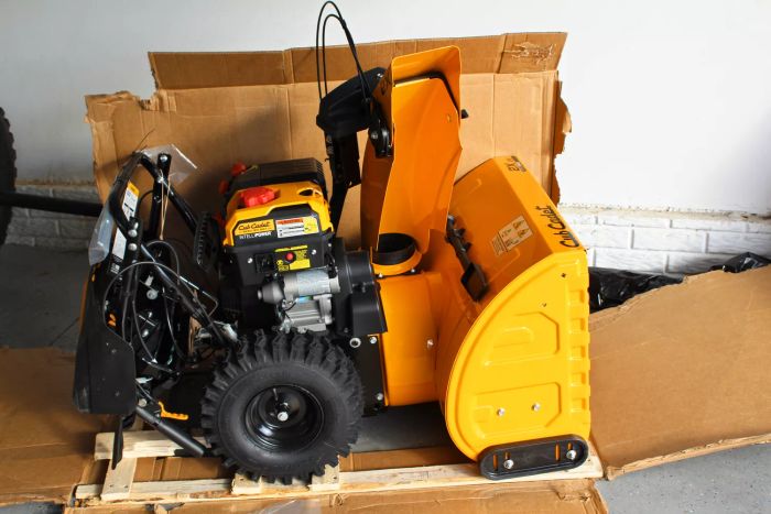 Cub Cadet 2X 26-Inch IntelliPower Snow Blowers showcased in their original cardboard packaging