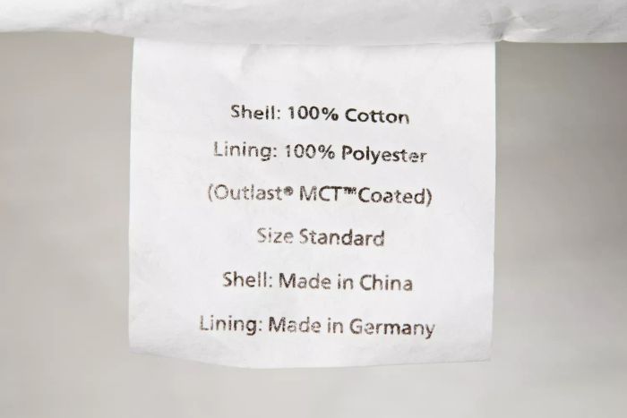 A close-up view of the product detail label on the Slumber Cloud Core Down Alternative Pillow