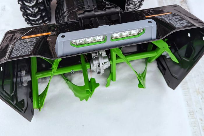 A close-up view of the blades on the EGO Power+ 24-Inch Cordless 2-Stage Snow Blower in action.