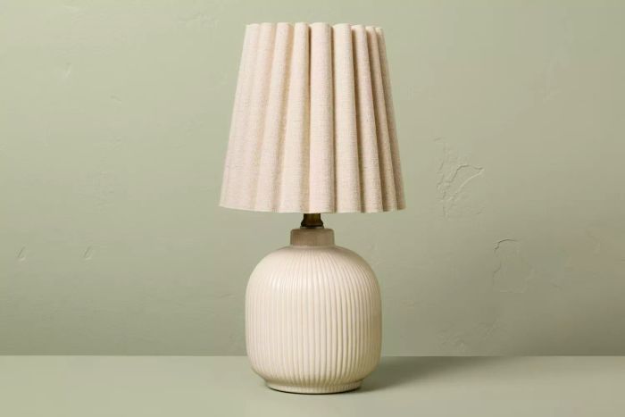 The Target Hearth & Hand with Magnolia Ribbed Ceramic Table Lamp is a perfect blend of design and function, with its elegant ribbed ceramic base and soft lighting that enhances your living space.