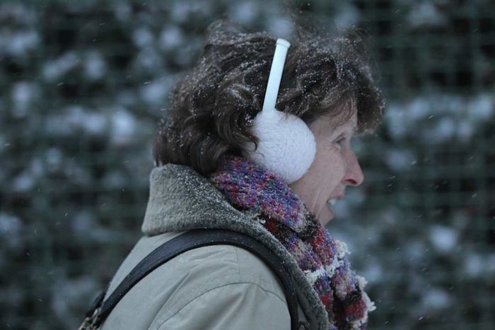 A woman wearing earmuffs