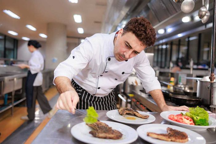 A chef preparing dishes at the expo station.