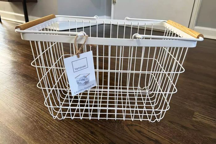Empty Yamazaki Tosca Wire Basket with a label hanging