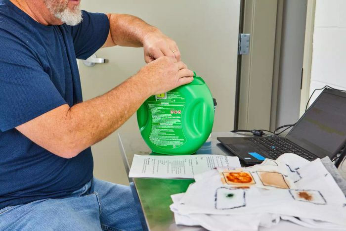 Person opening a package of Gain Original Flings Laundry Detergent