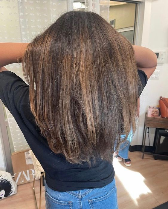 The same reviewer's hair looks soft and moisturized after using the treatment