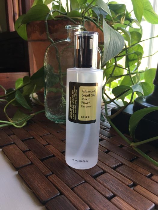 Reviewer photo showcasing a bottle of snail mucin essence.