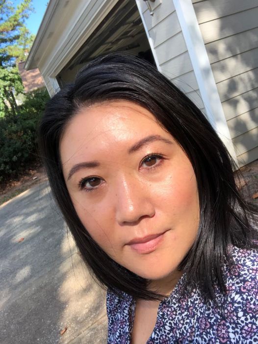 Reviewer photo showing their glowing, radiant skin.