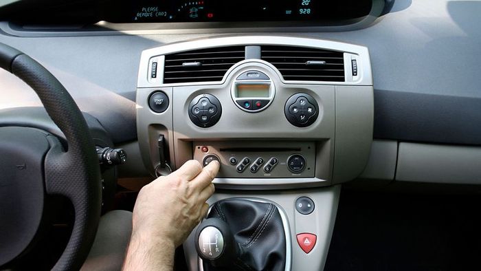 dimming the car's audio system while driving