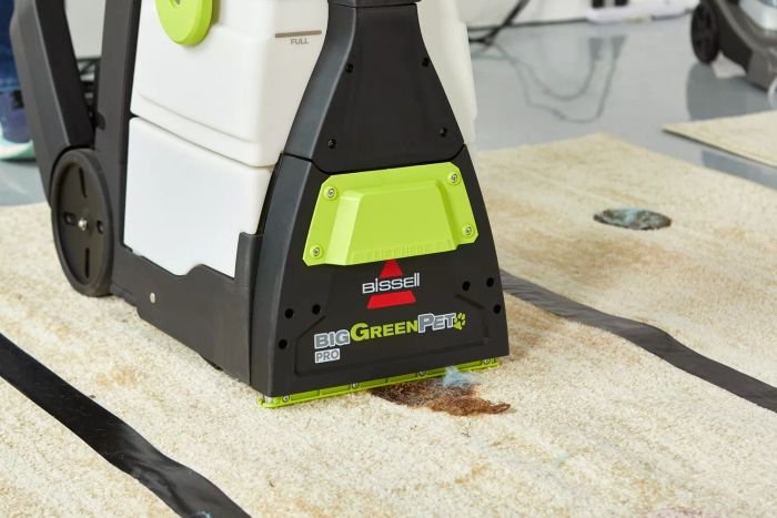 The Bissell Big Green Pet Pro Carpet Cleaner effectively removing a brown stain from a carpet.