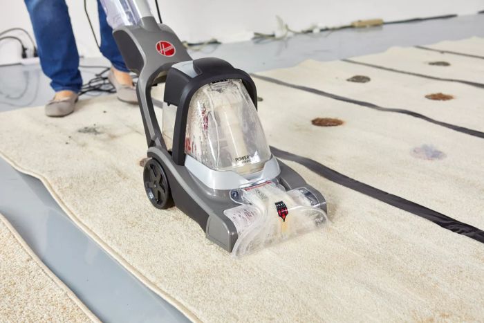 Hoover PowerDash Pet Advanced Carpet Cleaner in action on a carpet
