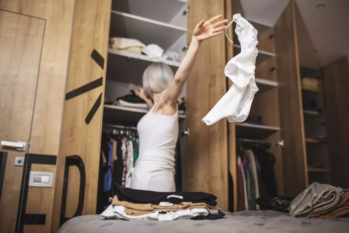 Women cleaning out closet 