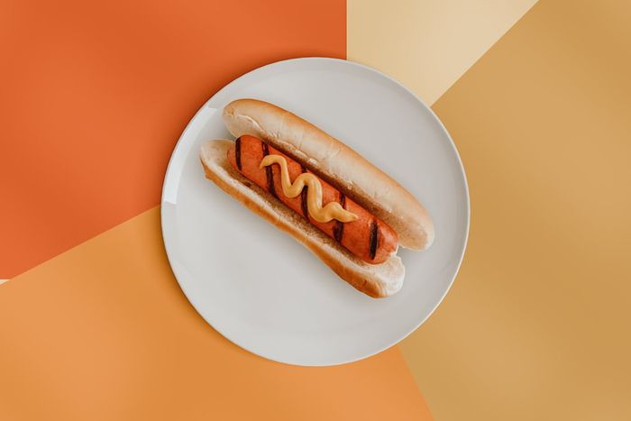 A top-down view of a hot dog on a plate