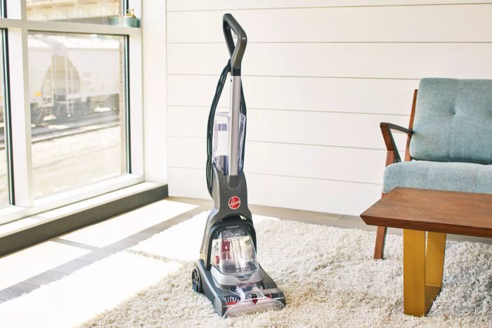 Hoover PowerDash Pet Advanced Carpet Cleaner positioned on a carpet in a room corner