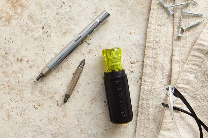 Klein Tools 11-in-1 Screwdriver and Nut Driver components spread out on a white surface