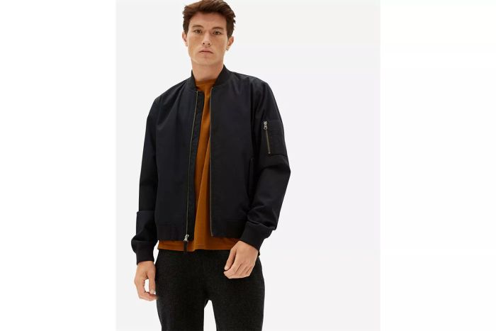 A person wearing the Everlane Bomber Jacket