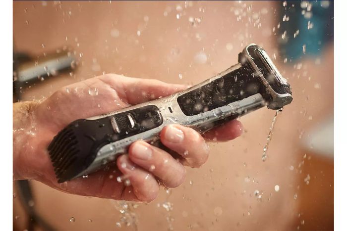 A hand holding the Philips Norelco Bodygroom Series 7000 Trimmer