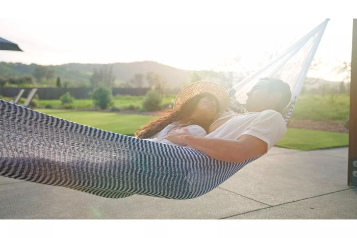 People laying in the Yellow Leaf Hammocks Signature Hammock
