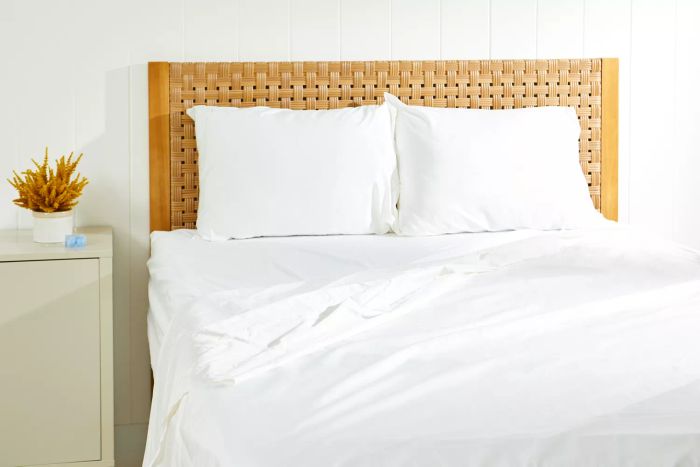 Bed dressed with sheets and pillowcases from the Crane & Canopy 400 Thread Count Sheet Set