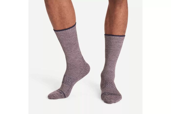 A person wearing Bombas Merino Wool Adventure Calf Socks